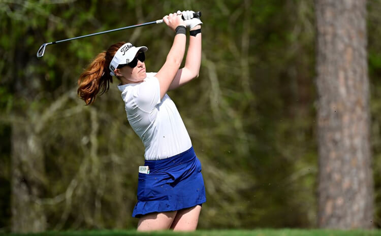 Abbey swinging a golf club