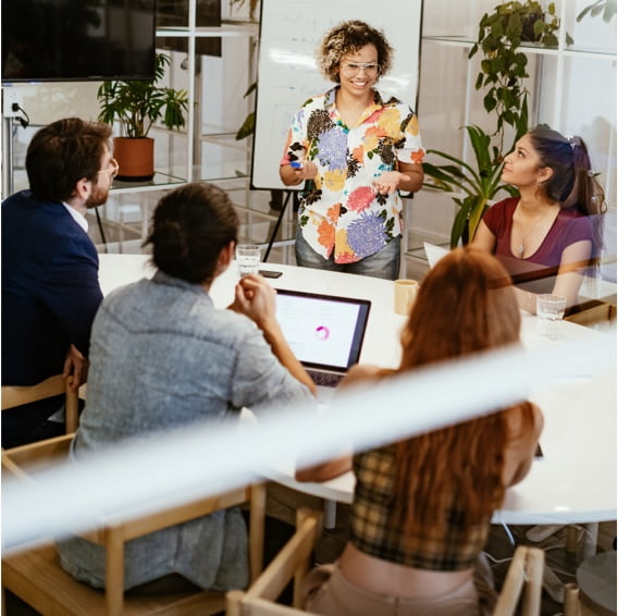 group of employees at a table having a meeting
